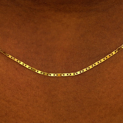 Close up view of a model wearing a 14k yellow gold Valentine Chain