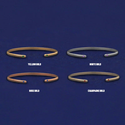 Four versions of the Gemstone Open Bangle shown in options of yellow, white, rose and champagne gold