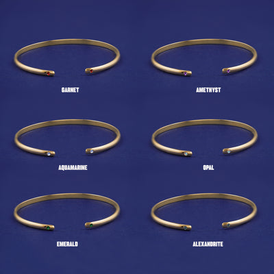 Six versions of the solid yellow gold Gemstone Open Bangle showing 6 different stone options